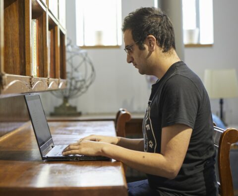 Man At Desk On Laptop